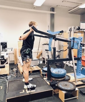 person testing Omnigym Squat equipment at University of Jyväskylä